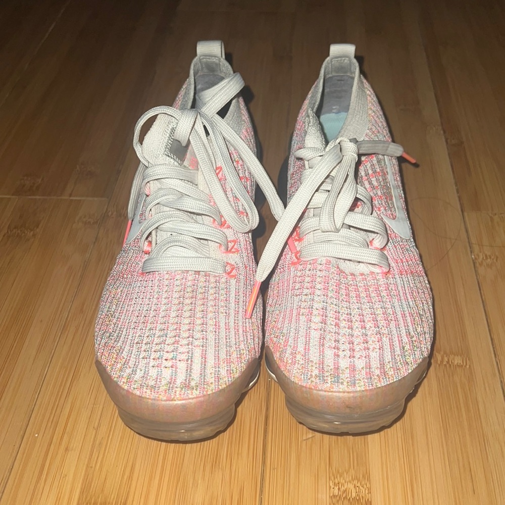 Pink with hints of yellow and blue women’s vapor max